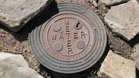 Sewer access cover in the ground